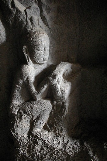 Monk holding a book, detail of the Mahmyr panel, Cave 10, Ellora.