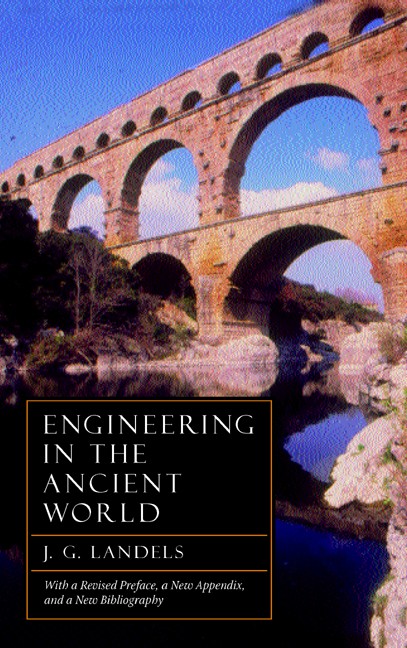 Book cover for Engineering in the Ancient World Revised Edition. Photo extends to all edges. An ancient three-tiered Roman stone aqueduct spans a river reflecting its arches with trees lining the shore beneath a blue sky. Below: Text is white on a black box outlined in gold.