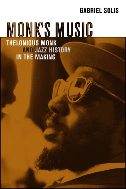 Book cover for Monk's Music. Below: A warm brown-toned close-up photo shows a bearded man from the shoulders up in profile wearing a hat and sunglasses reflecting a window scene. A blurred figure appears in the background. Text is black white tan dark brown or light gray with a white band at the top.
