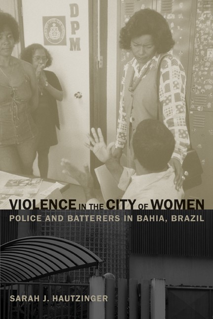 Book cover for Violence in the City of Women. Above: A sepia-toned photo of a woman confronting a seated man in an office as two other women look on. Below: A black-and-white exterior of a gated building with a curved awning. Text is black or light beige.